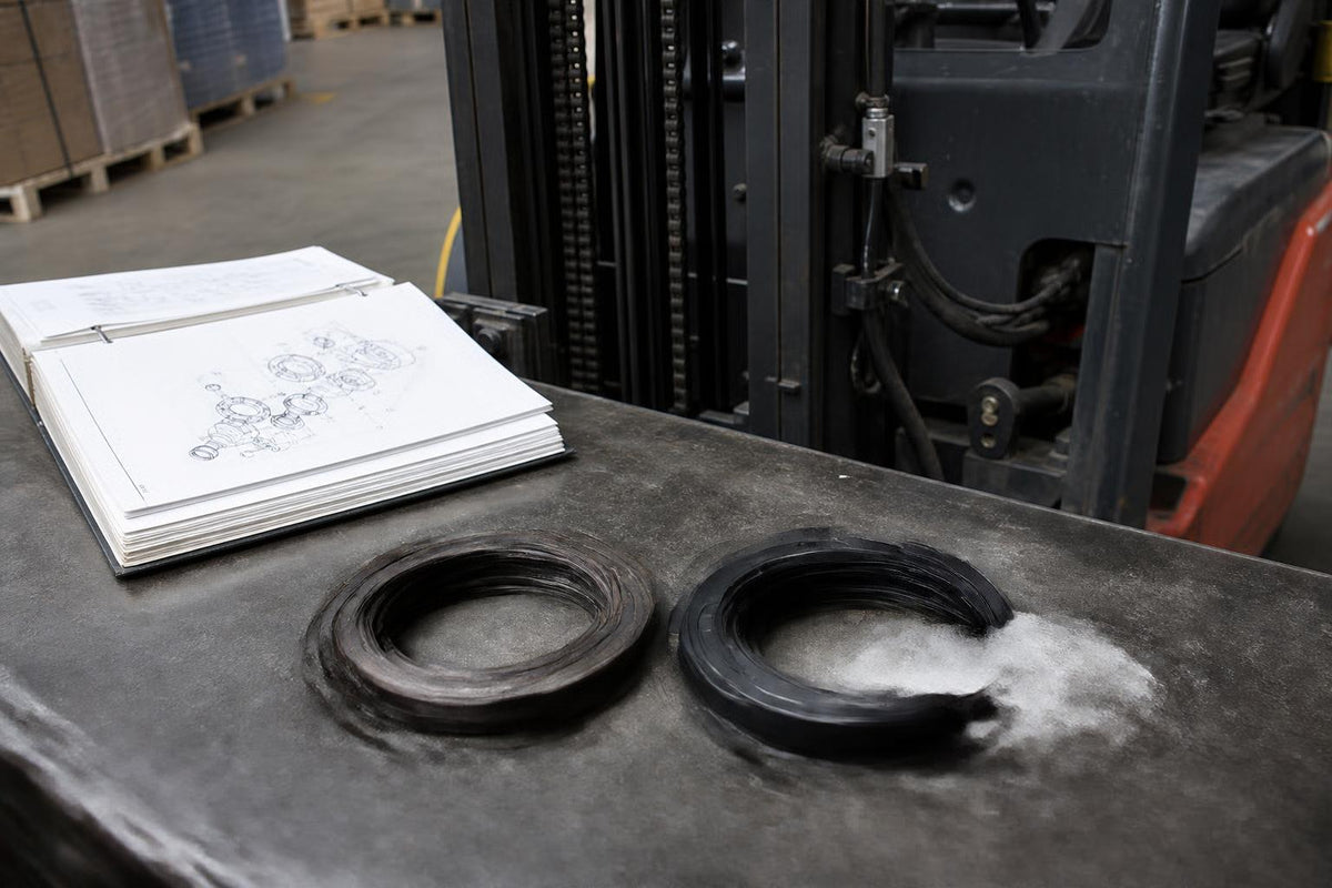 Forklift seal and parts documentation on a workbench